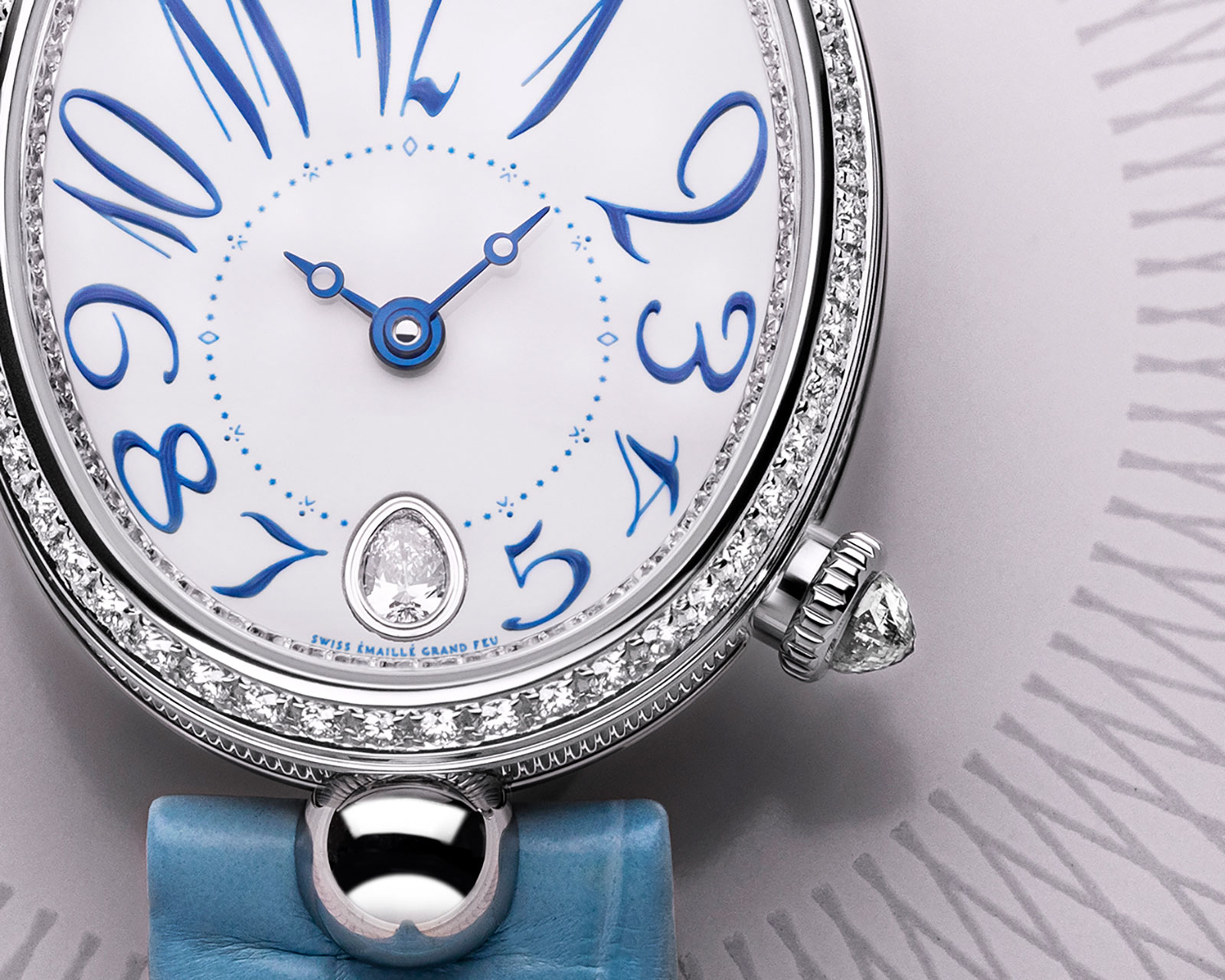 The white dials copy watches are decorated with diamonds.